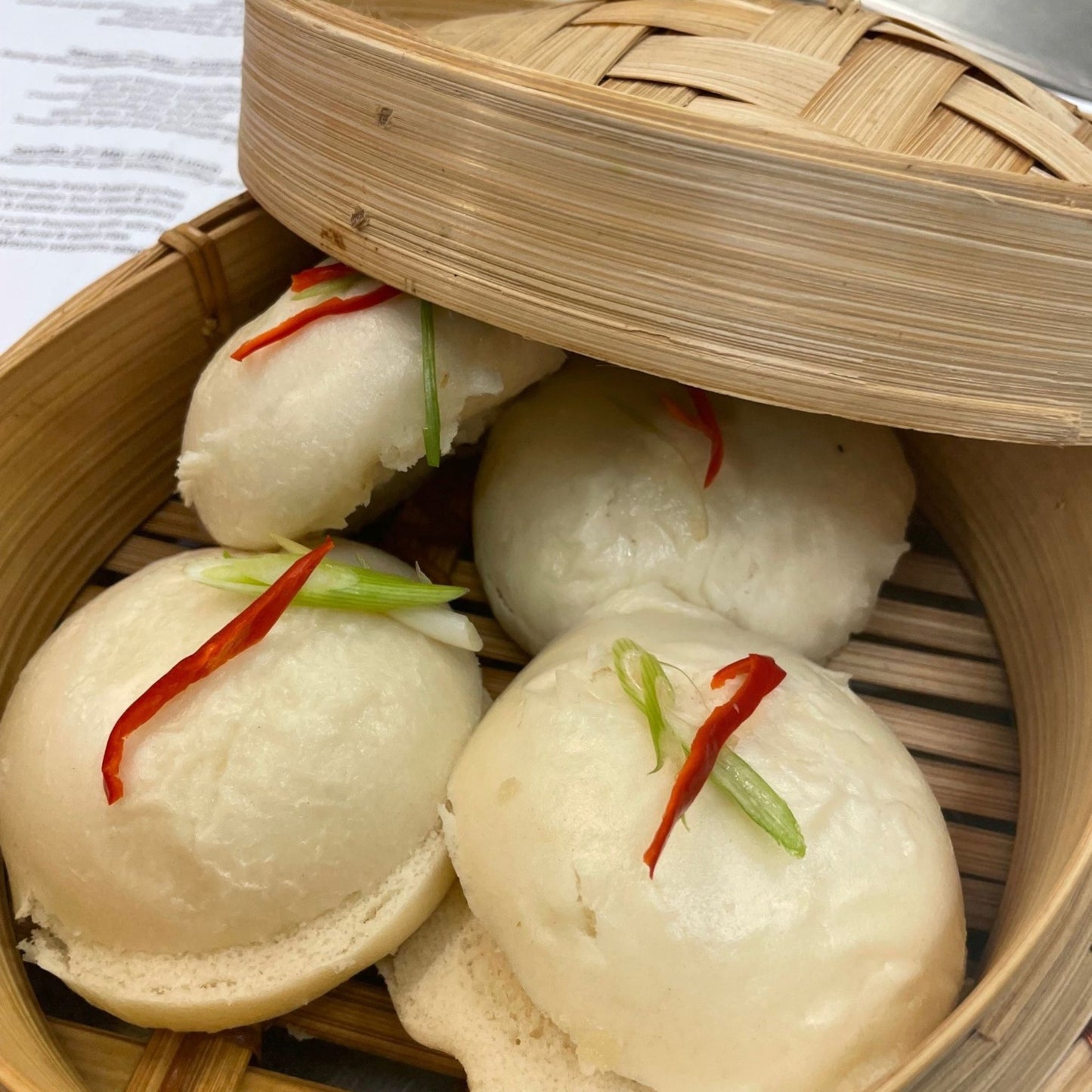 Bao buns in steamer basket