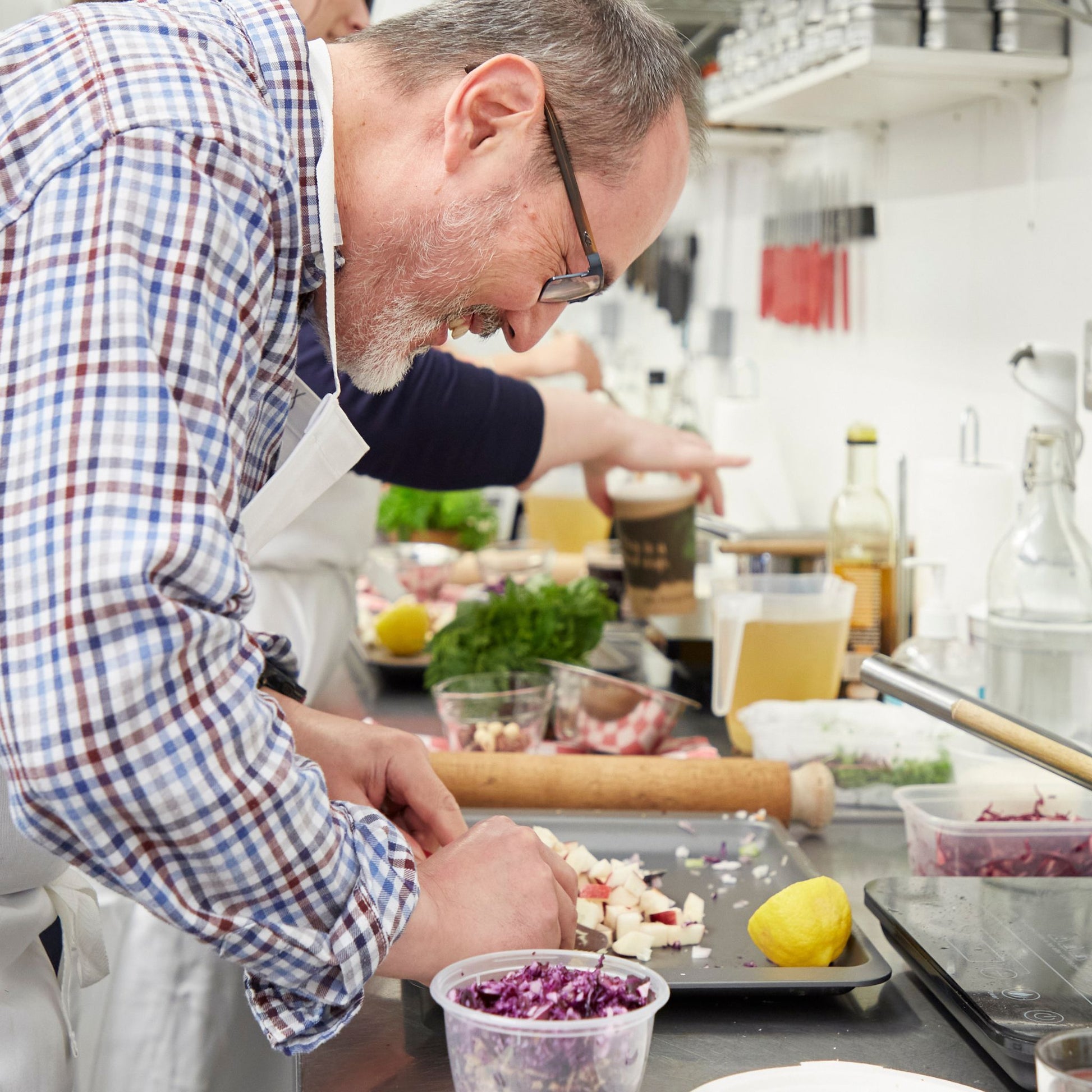 A middle aged man cooking