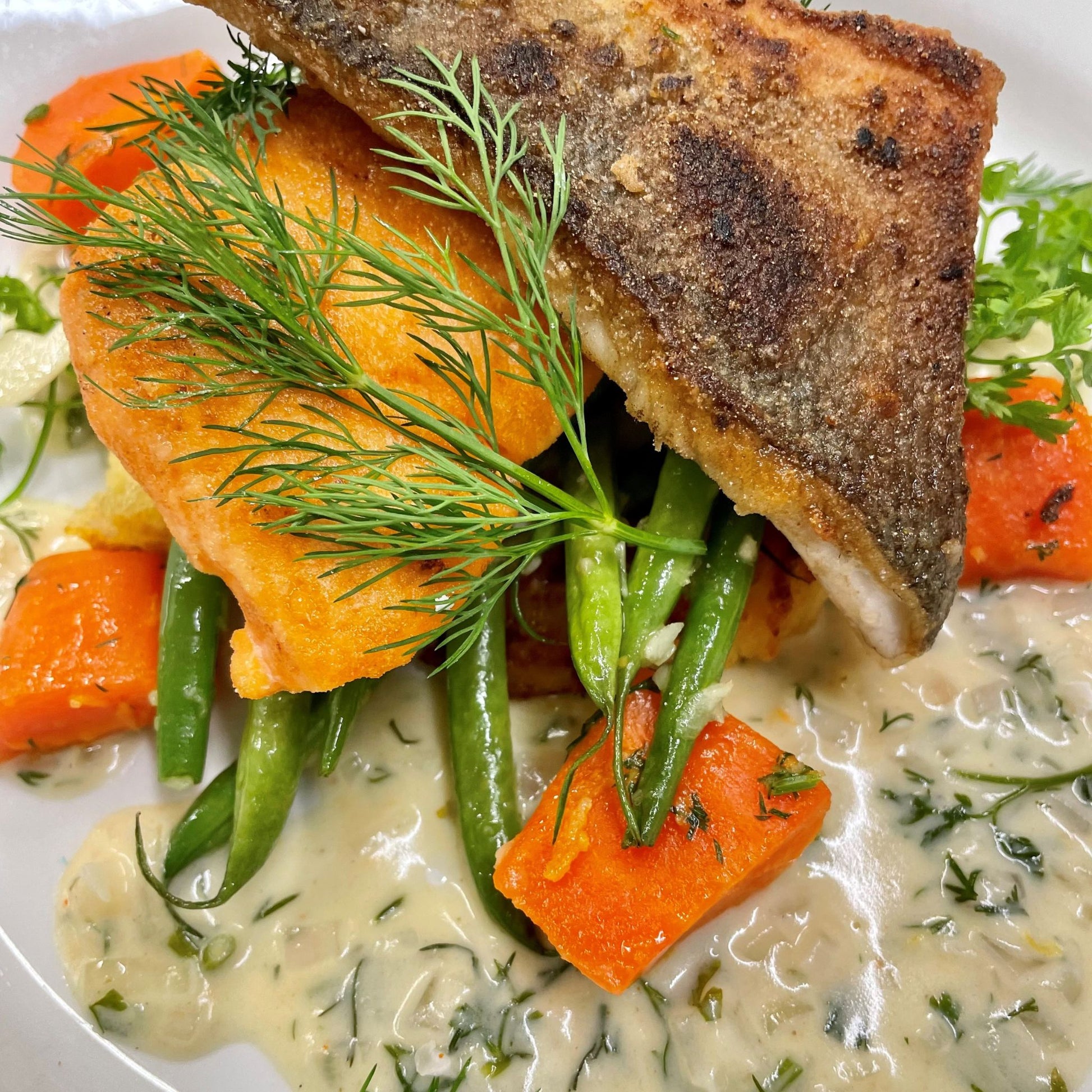 Fish dish with vegetables and sauce
