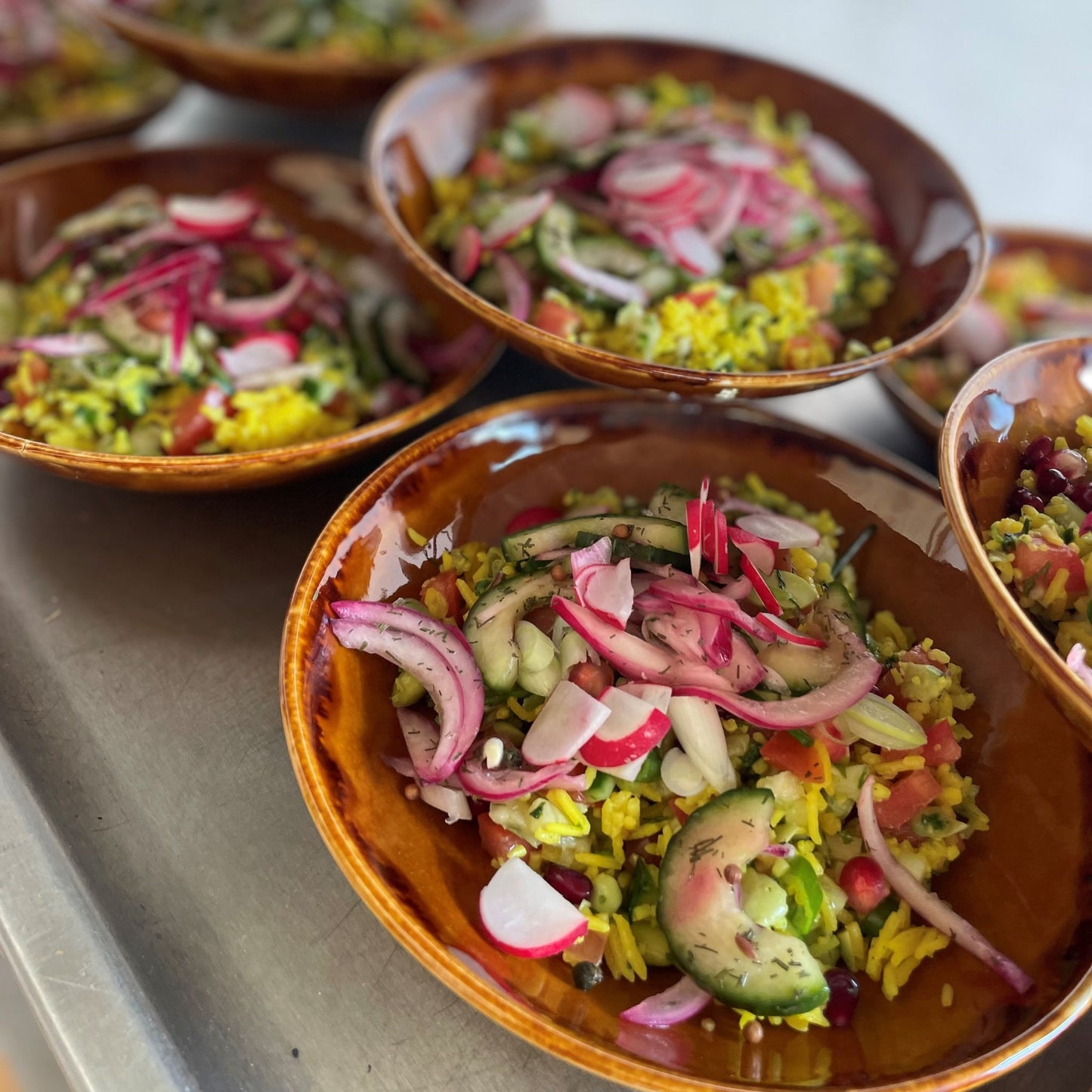 Greek salad in brown clay pots