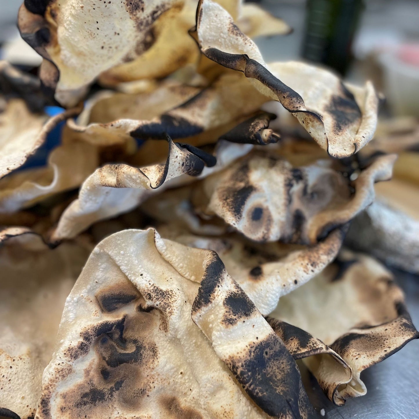 Indian flamed poppadom cooked on the fire