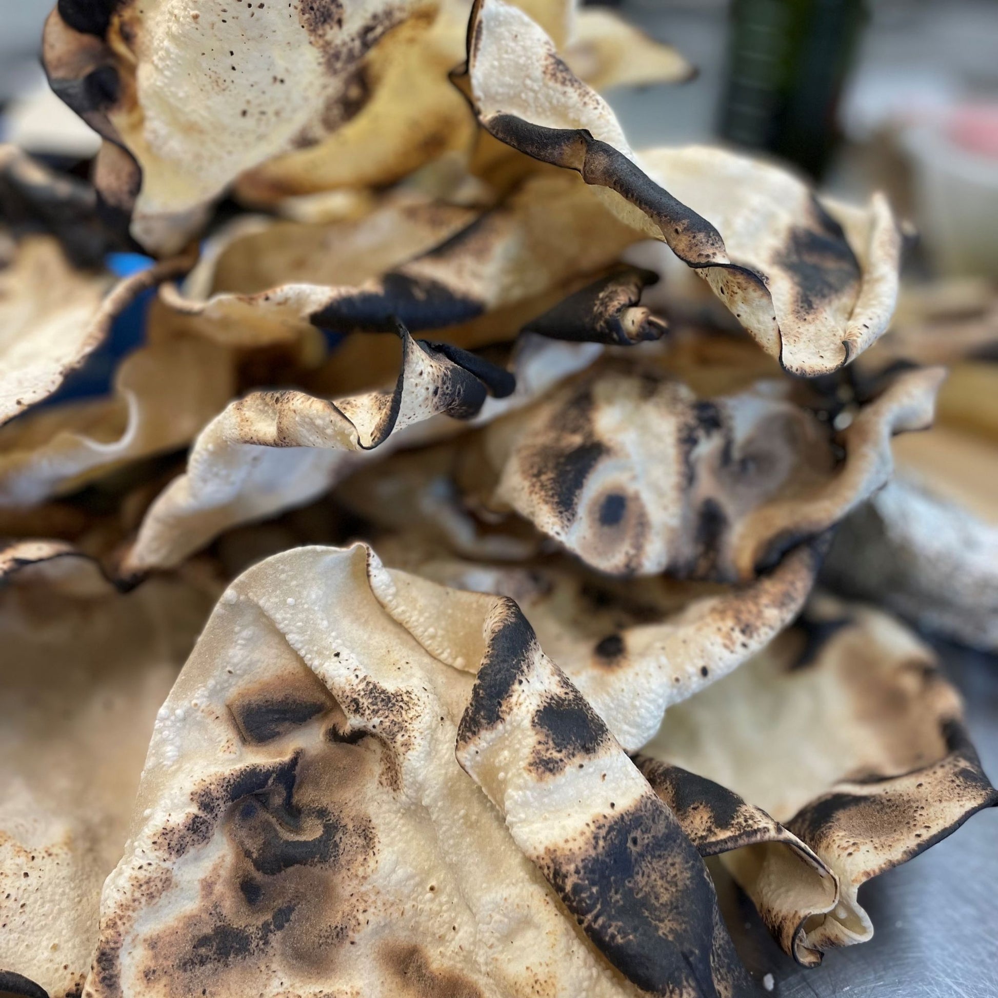Indian flamed poppadom cooked on the fire