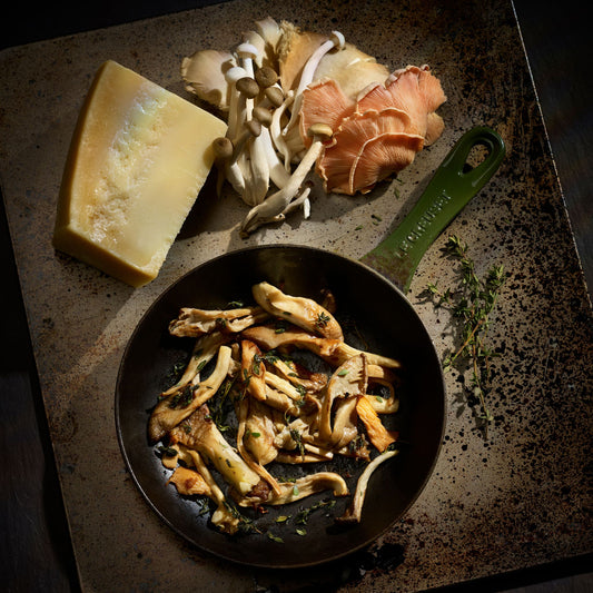 Italian mushrooms and Italian cheese with a green pan