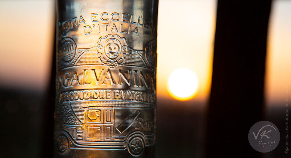 Water bottle with Italian writing with sun back lighting it