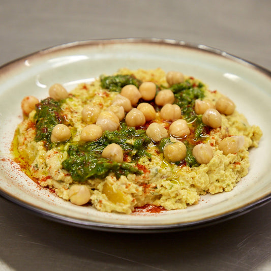 Plate of Middle Eastern houmous with chickpeas on top